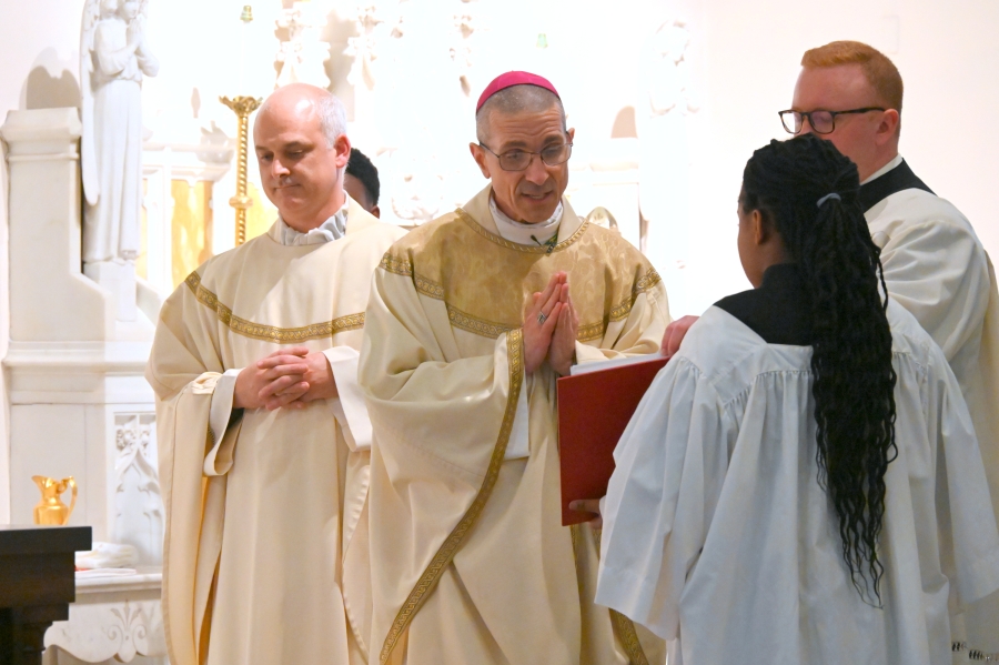 Bishop Ruggieri blesses the water.