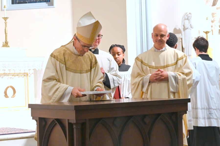 Bishop Ruggieri plays the relic in the altar.