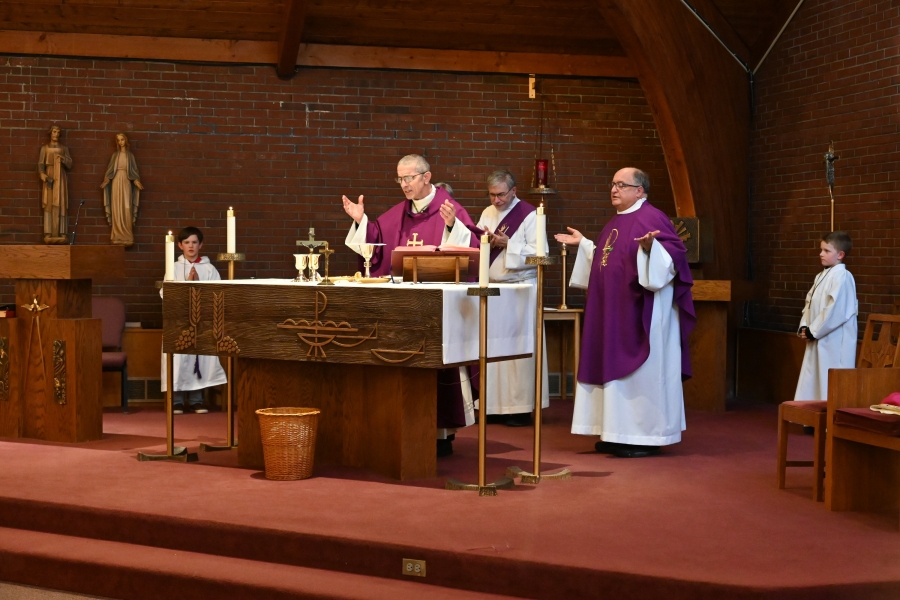 Bishop James Ruggieri and Father Phil Tracy celebrate the Liturgy of the Eucharist at St. Charles Borromeo Church.