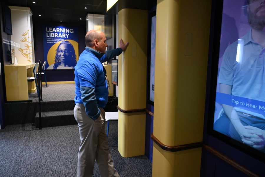 Catholic Charities CEO Steve Letourneau listens to stories of hope.