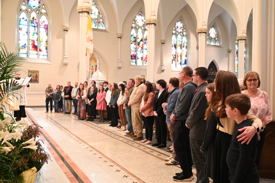Large group lined up facing the altar