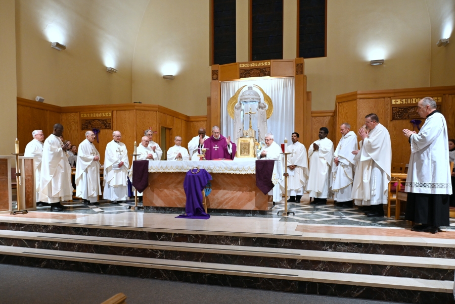 Priests join with the bishop for the celebration of the Liturgy of the Eucharist.
