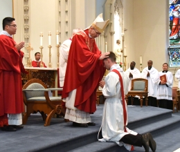 Bishop Ruggieri lays hands on Deacon Matthew Valles.