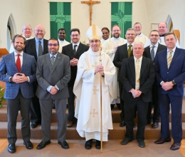 Eight deacon candidates with Bishop James Ruggieri, three priests, two deacons, and Peter Czerwinski.