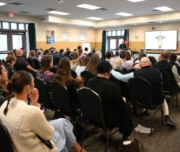 Conference attendees listen to Bishop James Ruggieri.