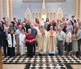 Posed photo of couples with Bishop Ruggieri and Msgr. Andrew Dubois