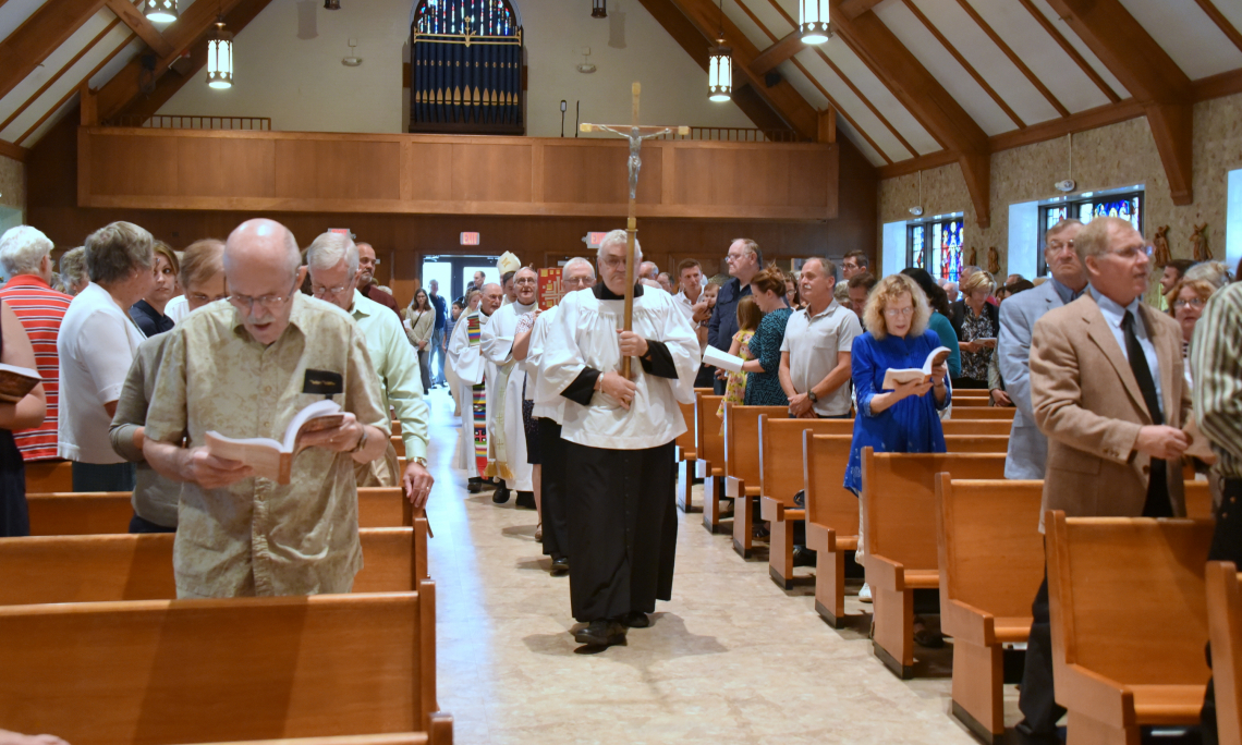 The opening procession of the 100th anniversary Mass at St. Rose of Lima Church in Jay, Maine.