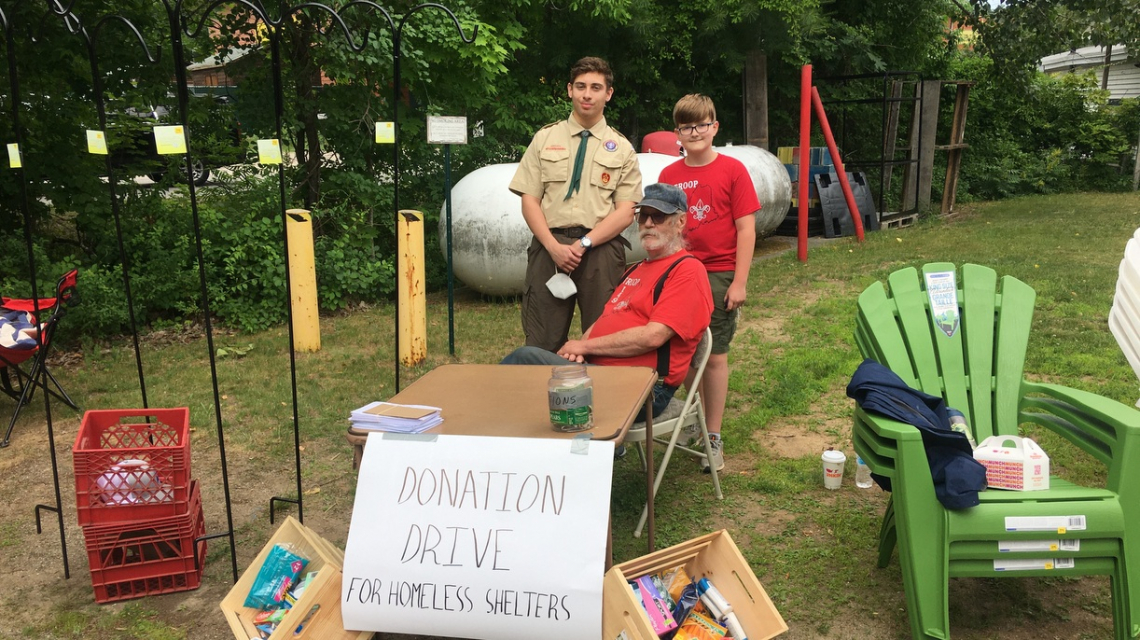 Joe Angelo collecting items.