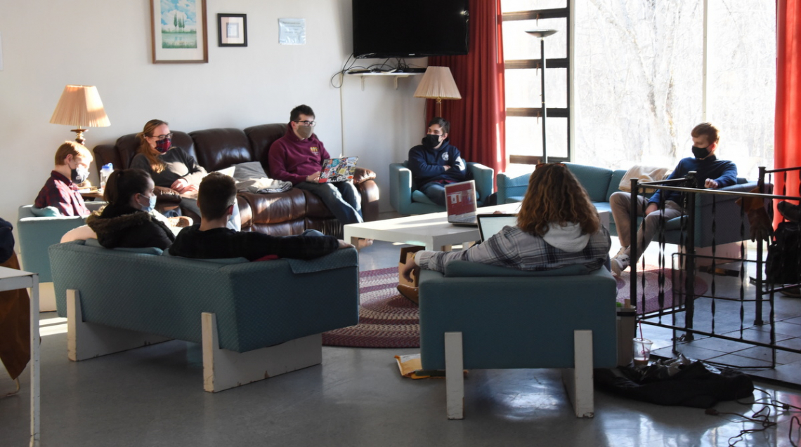 Students gathered at the Newman Center in Orono