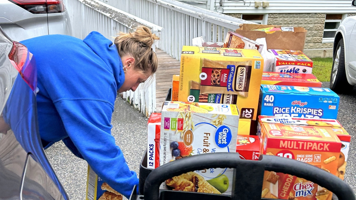 Woman loading cart