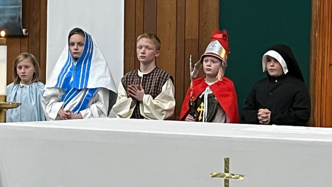 Four children dressed as saints