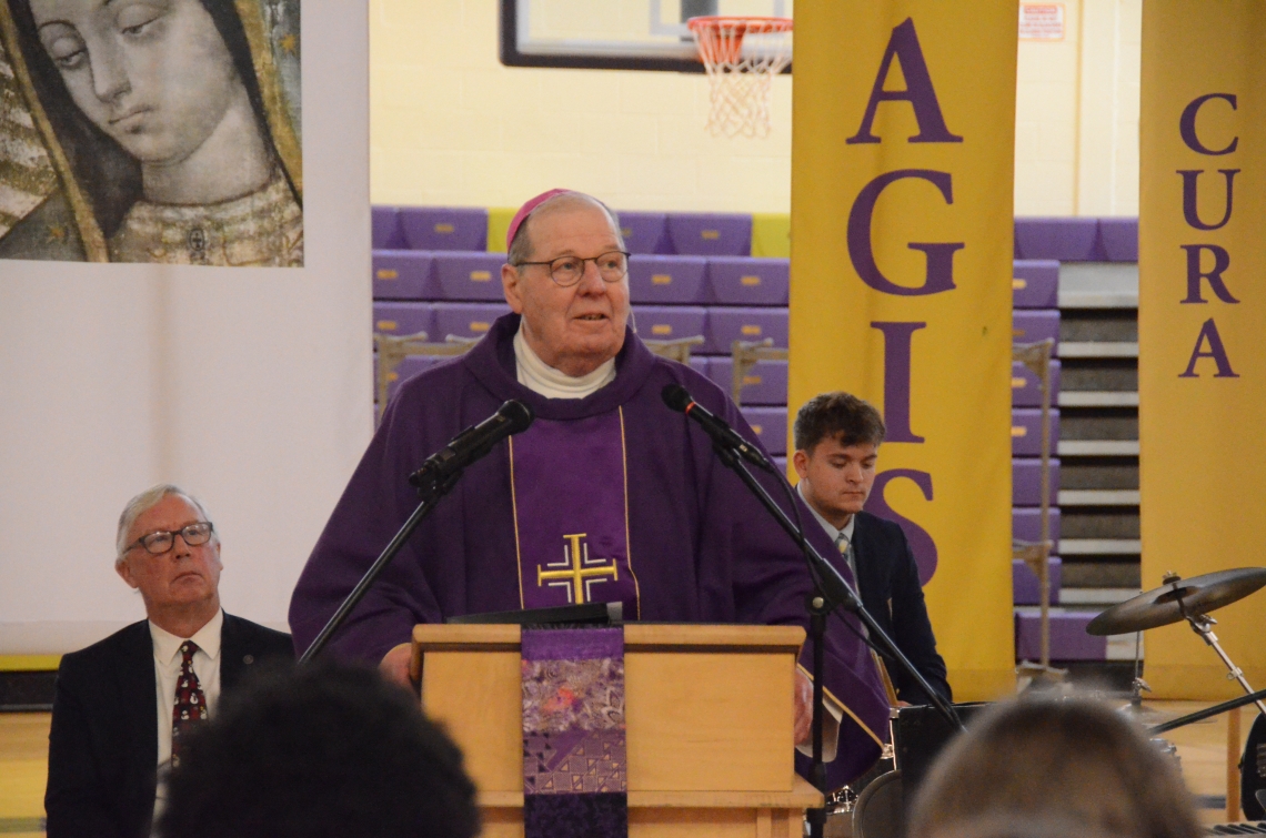 The bishop speaks from the altar