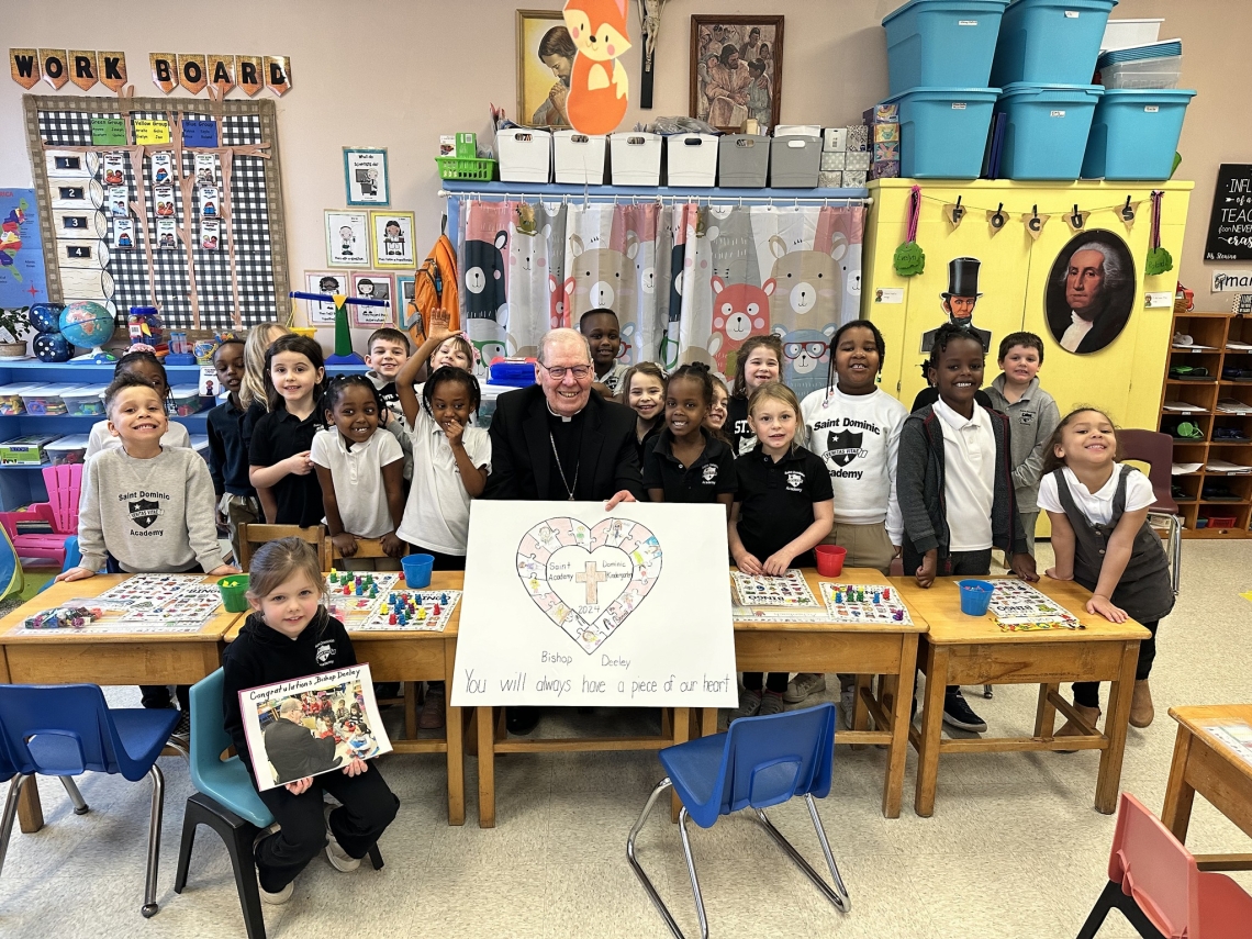 Bishop surrounded by students