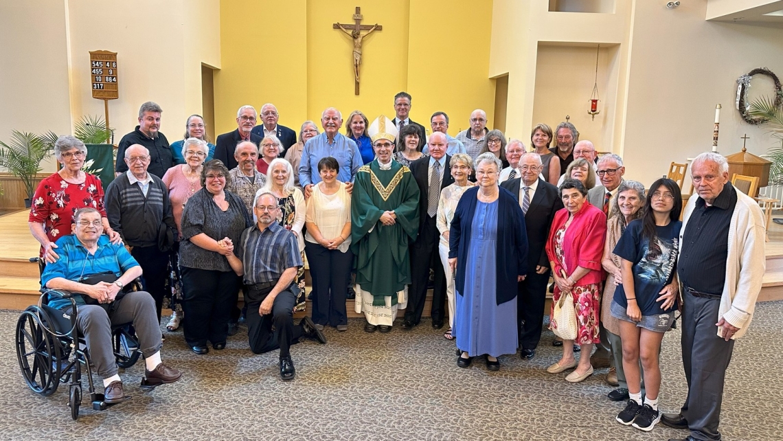 Couples with Bishop Ruggieri at the Silver and Gold Anniversary Mass 