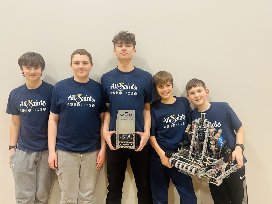 Team Blitz posing with their robot.