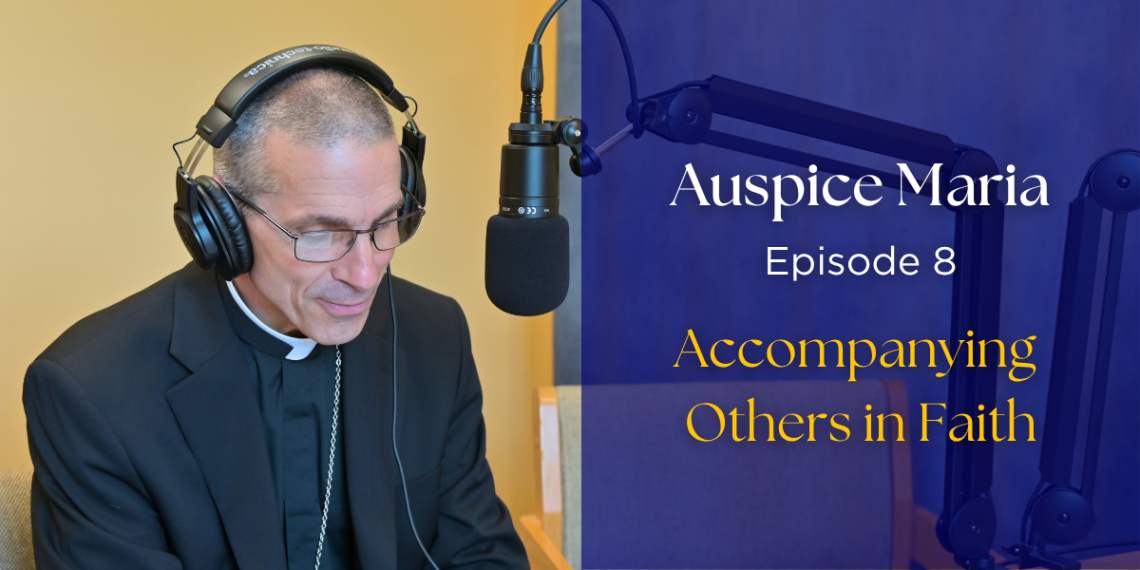 Bishop Ruggieri sitting in front of a microphone. text: "Auspice Maria, Episode 8, Accompanying others in faith"