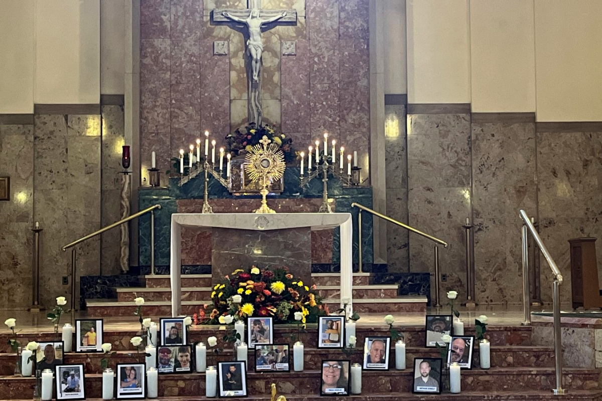Holy Family Church with photos of shooting victims