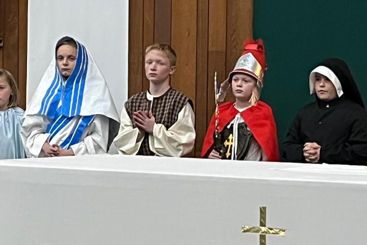 Four children dressed as saints