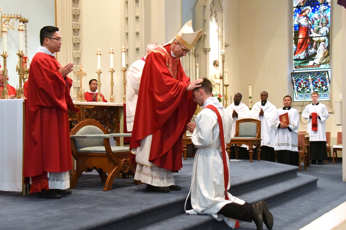 Bishop Ruggieri lays hands on Deacon Matthew Valles.