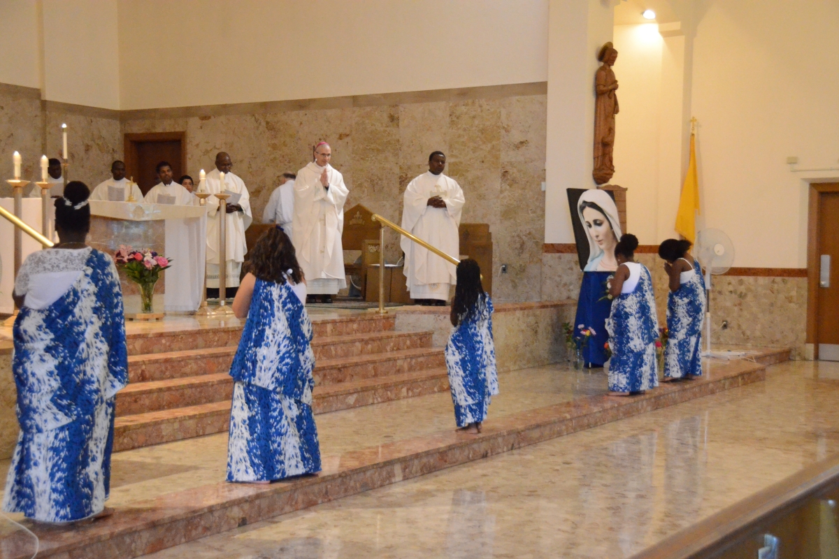 Children dancing at the altar 