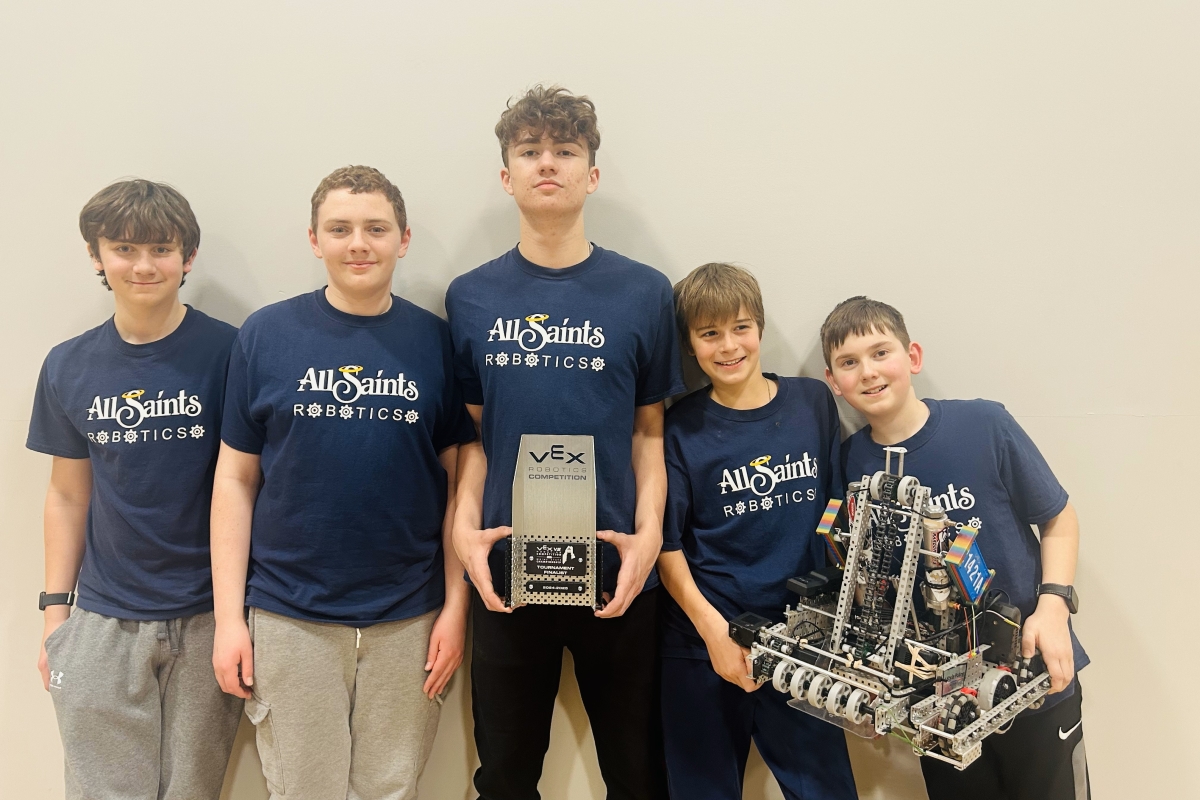 Team Blitz posing with their robot.