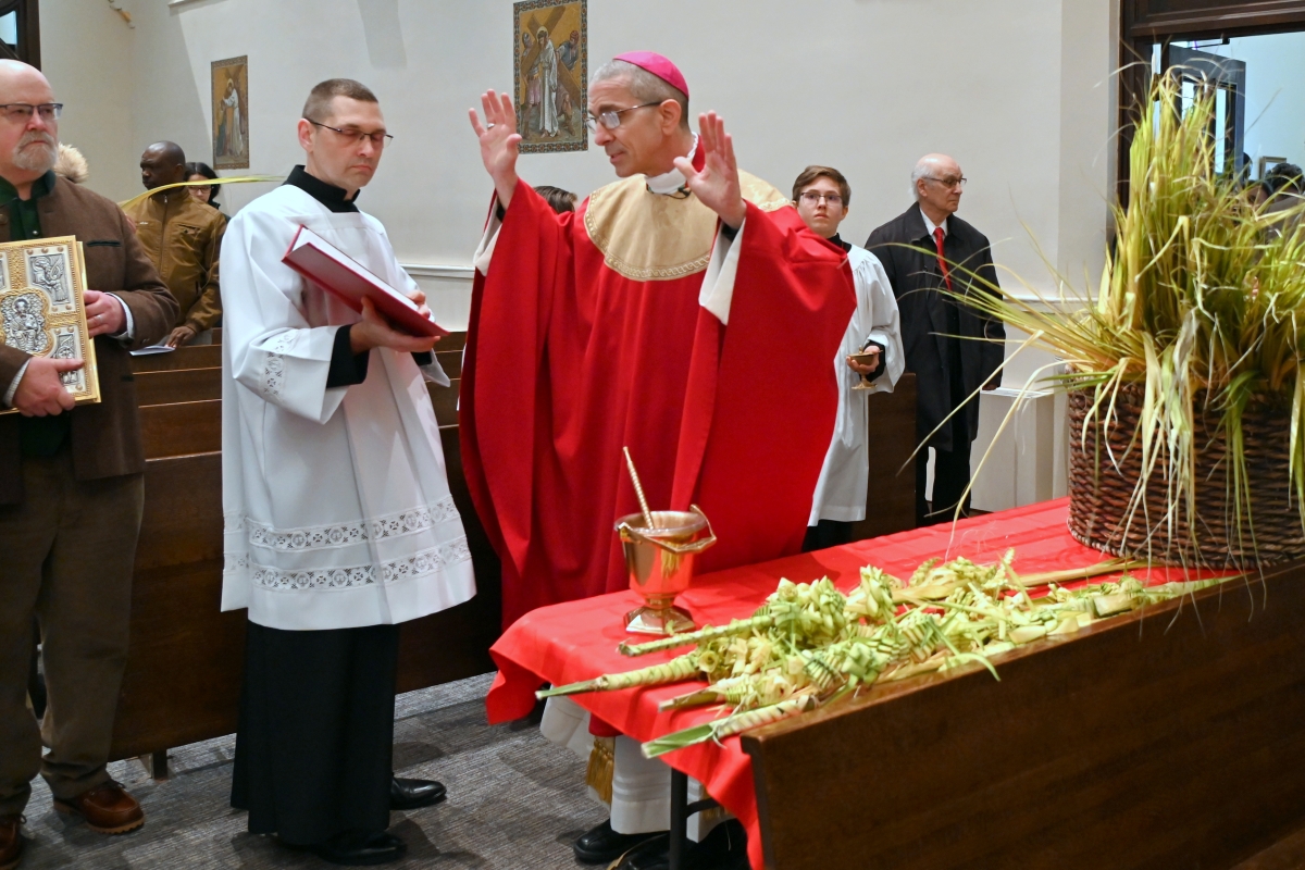 Bishop James Ruggieri blesses palm branches