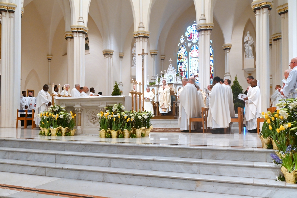 Bishop James Ruggieri and priests in the sanctuary of the cathedral