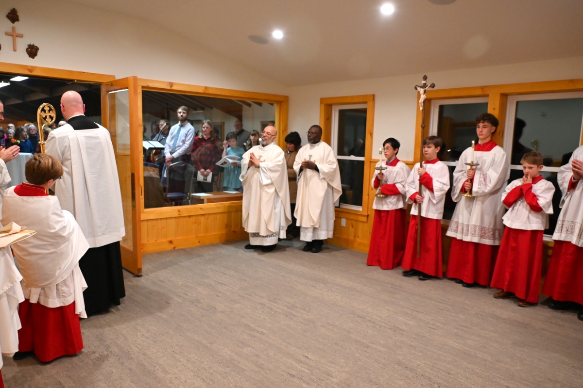 Priests and altar servers gathered in the narthex for the blessing.