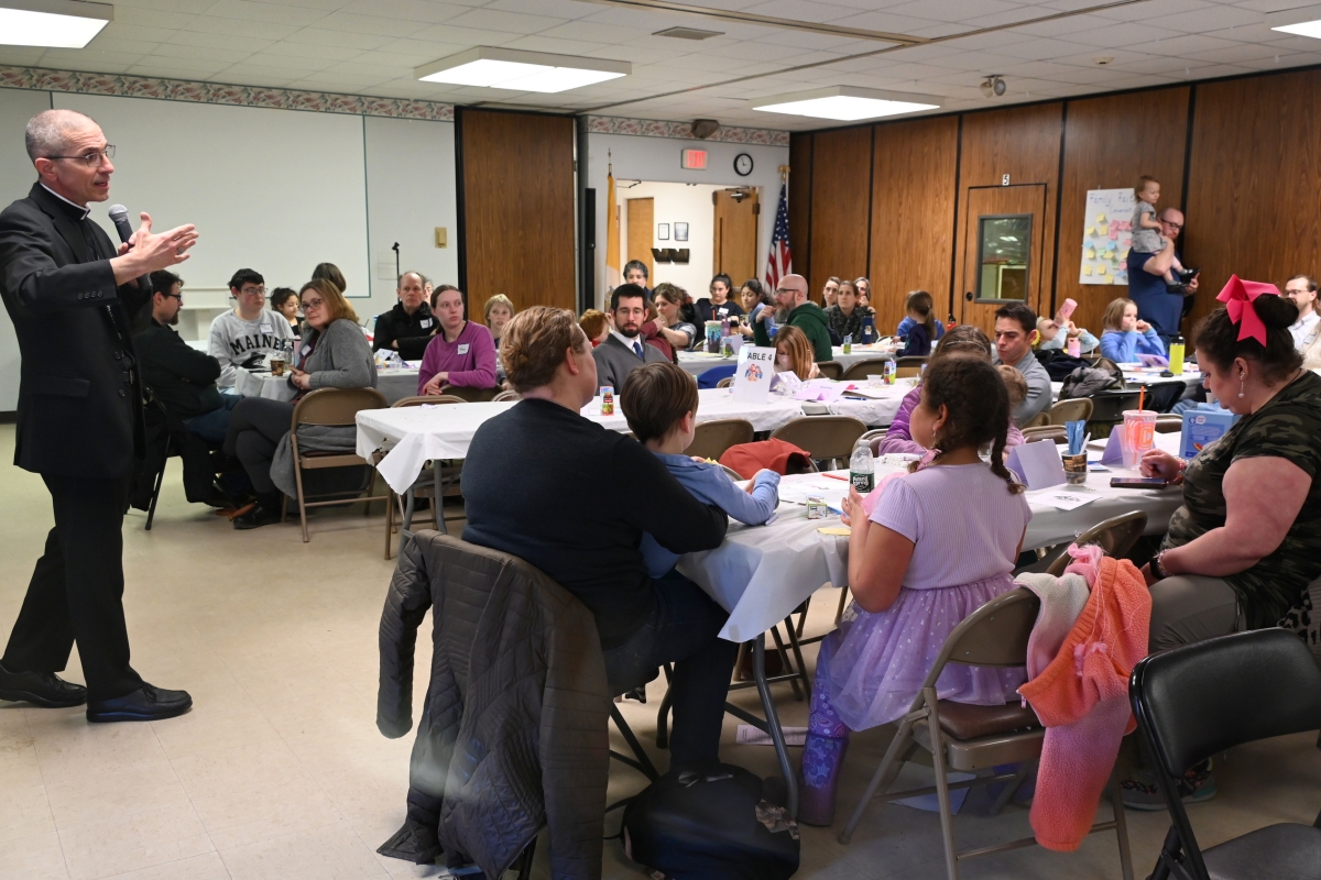 Bishop James Ruggieri takes part in a question and answer period.